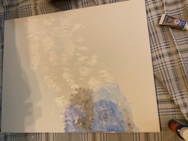 Start of painting. Some blue, gray, and white scattered cloud-like features.
