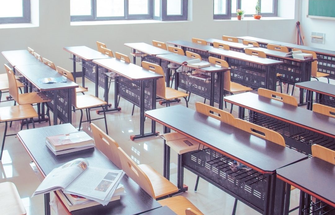 Classroom full of empty desks.