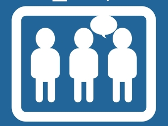 3 people in an elevator with one speaking
