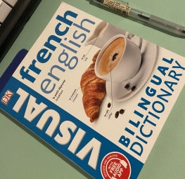 French English Billingual dictionary with a croissant and cup of coffee on the cover